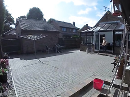 Blonde is hanging out topless at backyard and provoking the guy to fuck her