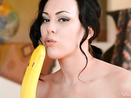 Hot brunette fucks with banana before posing in sexy green dress