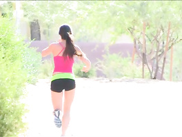 Sporty babe does exercises outdoors in sexy training clothes
