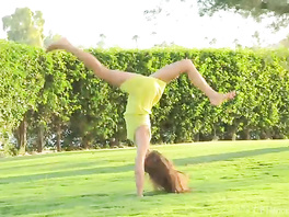 Slender brunette with small buttocks hotly masturbates outdoors