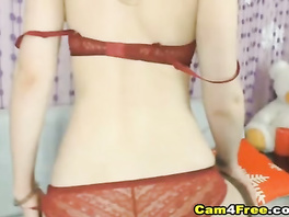 Skinny hot chick poses in red underwear and black stockings